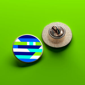 CHEK promotional pin badge featuring the logo design