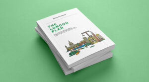 The London Plan stack of printed reports. The Mayor of London Logo on white report with campaign illustration, on green background.