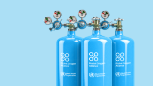 Blue medical oxygen bottles with Global Oxygen Alliance and World Health Organization logos on a light blue background.