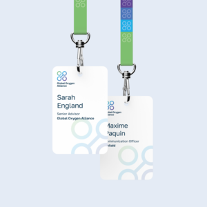 Two conference lanyards branded with the new Global Oxygen Alliance logo and visual identity elements.